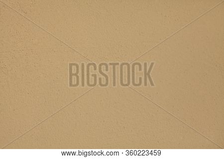 Beige Or Light-brown Wall, Texture, Background. The Building Wall, Painted With Water-based Paint. P