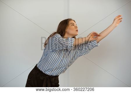 Young Beautiful Girl Is Dancing In The Style Of Contemp.