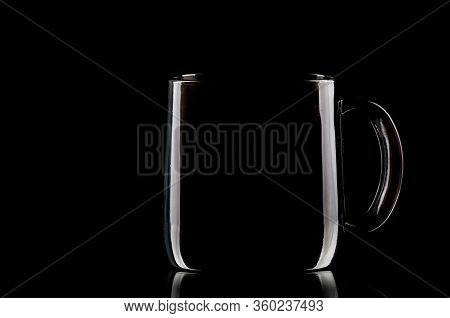 Cup On The Black Background