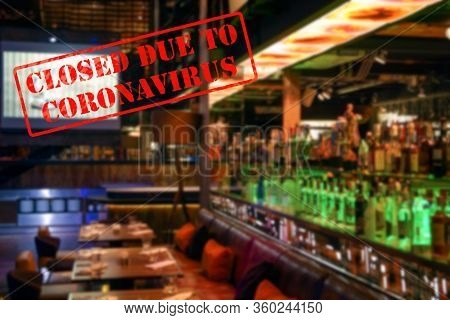 Defocused, Blurred View Of Interior Of An Upmarket Bar Or Restaurant, Empty And Closed Due To Corona