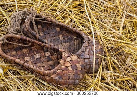 Bast Shoes On The Straw, Traditional Wicker Shoes Of Ancient Russia