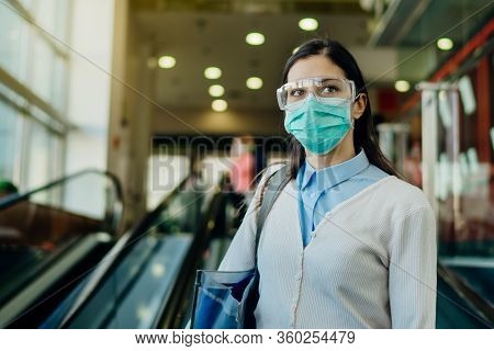 Careful Young Woman Going To Work  During Coronavirus Covid-19 Outbreak.working Businesswoman With P