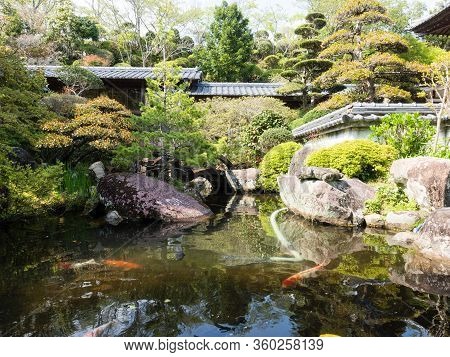 Sukumo, Japan - April 8, 2018: Traditional Japanese Garden With Pond On The Grounds Of Enkoji, Templ