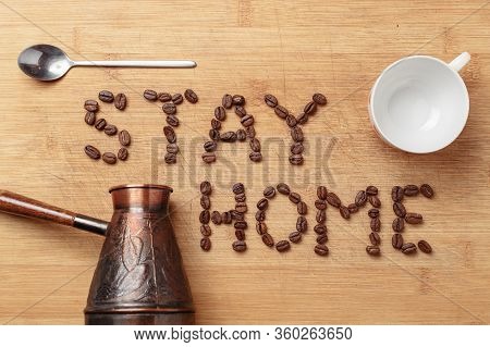 Roasted Coffee Beans, A Spoon, A Copper Cezva And A White Porcelain Cup