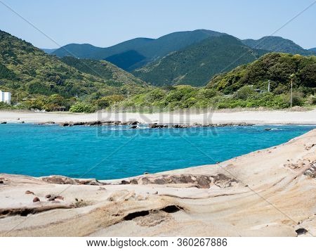 Sandstone Rock Formations And Clear Blue Waters At Tatsukushi Coast - A Natural Scenic Landmark Near