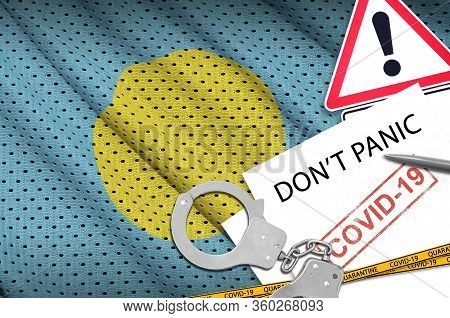 Palau Flag And Police Handcuffs With Inscription Dont Panic On White Paper. Coronavirus Or 2019-ncov