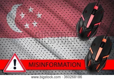 Singapore Flag And Two Computer Mouses. Misinformation During Coronavirus Or 2019-ncov Virus Concept