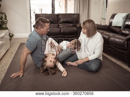 Covid-19 Stay At Home, Save Lives. Family In Staying Home Happy To Stop The Coronavirus Spreading.