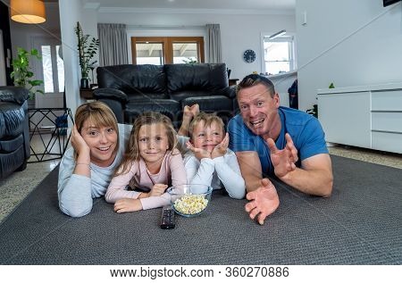 Covid-19 Stay At Home, Save Lives. Family In Staying Home Happy To Stop The Coronavirus Spreading.