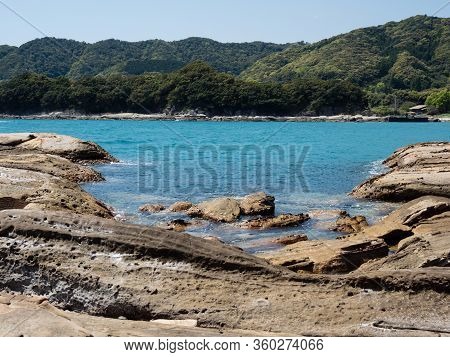 Sandstone Rock Formations And Clear Blue Waters At Tatsukushi Coast - A Natural Scenic Landmark Near