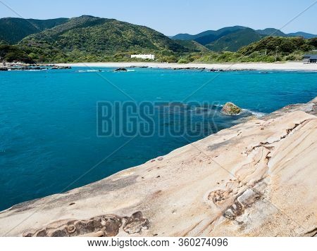 Sandstone Rock Formations And Clear Blue Waters At Tatsukushi Coast - A Natural Scenic Landmark Near