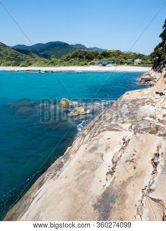 Sandstone Rock Formations And Clear Blue Waters At Tatsukushi Coast - A Natural Scenic Landmark Near