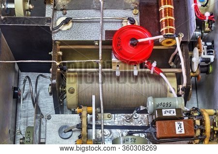Inside View Of High Frequency Power Amplifier With Capacitors, Coils And Other Components