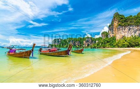 Beautiful View Of Long Tail Boats On Water In Railay Beach Bay, Thailand, Krabi Town. Famous Tourist