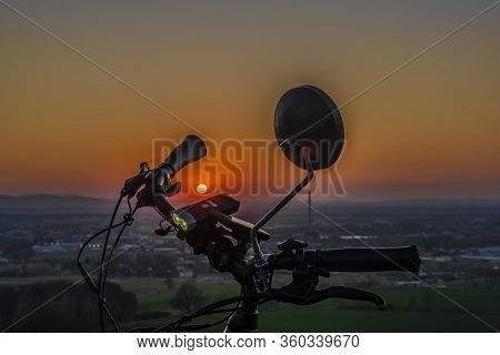 Handlebar Mirror And Light On Electric Bike In Sunset Color Evening
