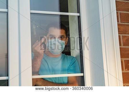 Man In Medical Mask Showing Thumbs Up Sign Fuck. Go Away From Here. Young Angry Man With Surgical Me