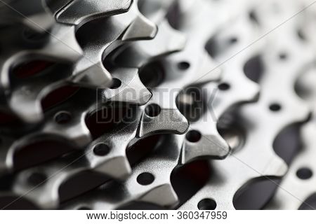 Close-up Of Bicycle Roller Chain That Transfers Power From Pedals To Drive. Macro Shot Of Metal Whee