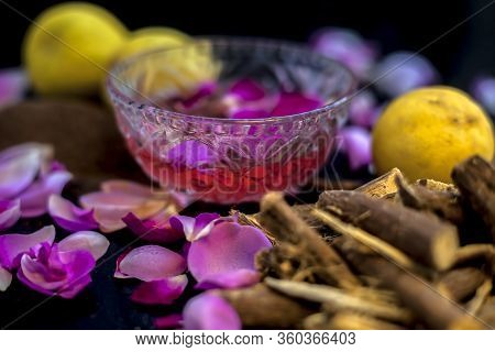 Close Up Face Mask Of Age-old Herb Mulethi For Radiant Skin On A Black Surface Consisting Of Some Le