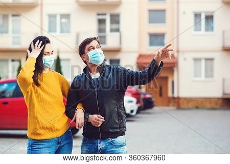 People In Face Mask With Positive Emotions. Global Coronavirus Pandemic. Young Couple In Protective