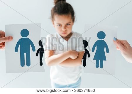 Selective Focus Of Man And Woman Holding Ripped Paper With Separated Family Near Displeased African 