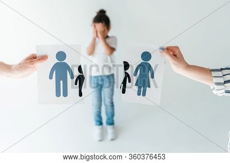 Selective Focus Of Man And Woman Holding Ripped Paper With Separated Family Near Adopted African Ame