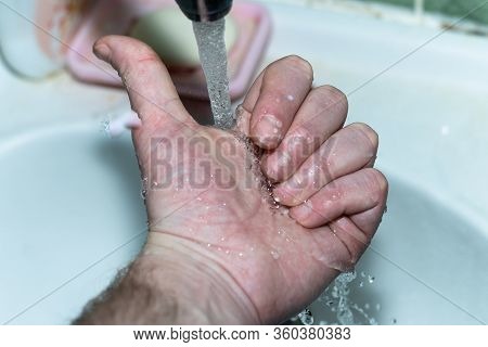 Male Hand. Hand Washing With Water In The Sink.