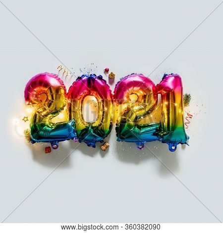 Rainbow Colored Foil Balloons In The Form Of Numbers 2021. New Year Celebration