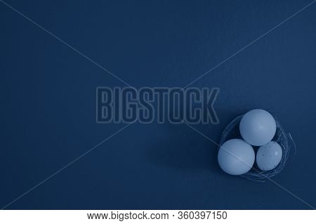 Eggs In A Basket On A Green Background. White Chocolate And White Speckled Eggs. Flat Lay, Copy Spac