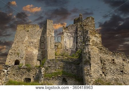 Scenic Ruins Of Ancient Castle  Likava Outside On Blue Cloudy Sky Background. Liptov Region. Slovaki