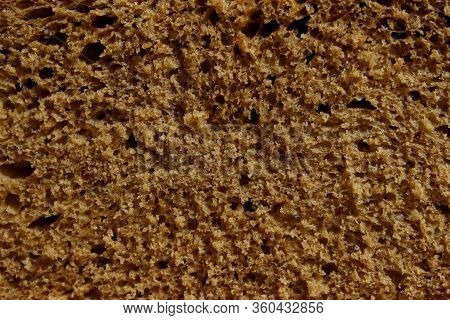 Dark Bread Texture Background. Food, Bakery Concept. Cropped Shot Of Bread, Horizontal View.