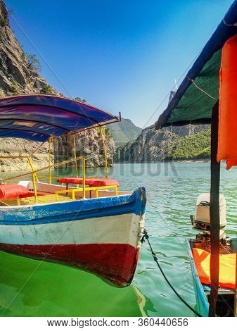 A Boat With A Canopy On The River. River Boat. Pleasure Boat On The River In Albania.