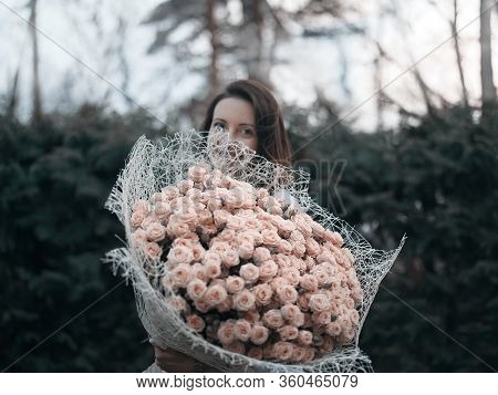 Young Woman Holding Giant Bouquet Of Roses, Twilight Scenne, Shallow Dof