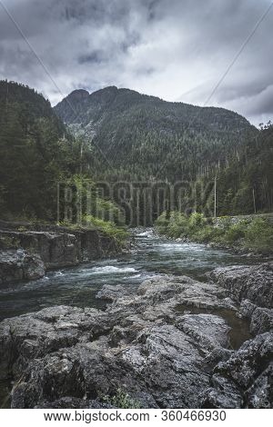 The Beauty Of Wally Creek Pullout. Forest, Wild River, Rocks And Trees On Vancouver Island In Canada