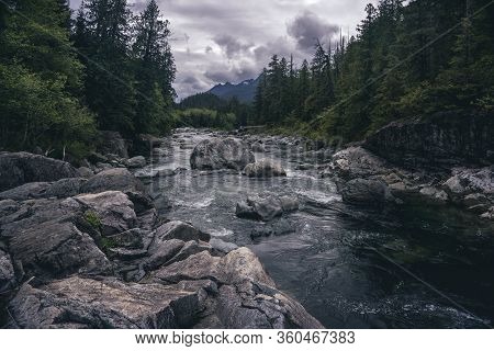 The Beauty Of Wally Creek Pullout. Forest, Wild River, Rocks And Trees On Vancouver Island In Canada