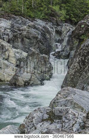 The Beauty Of Wally Creek Pullout. Forest, Wild River, Rocks And Trees On Vancouver Island In Canada