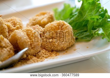 Deshelled Prawns Fried With Golden Salted Egg. Crispy Exterior Fried Prawns, Whilst Preserving The T