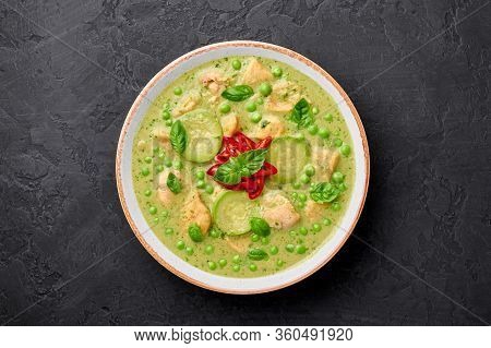 Thai Green Curry With Chicken Or Gaeng Kaew Wan Gai In White Bowl At Black Slate Background. Thai Gr