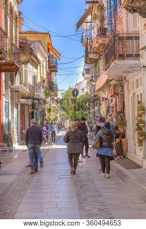 Nafplio, Greece - March 30, 2019: Old Town Street Panorama With Restaurants In Nafplion, Peloponnese