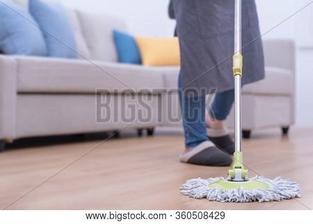 Mop Floors. Young Woman Washing Wooden Ground Floor At Home With A Mop, Cleaning Equipment, Concept
