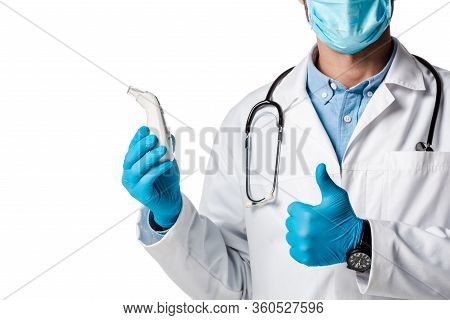 Cropped View Of Doctor In Medical Mask And White Coat Holding Non-contact Pyrometer And Showing Thum