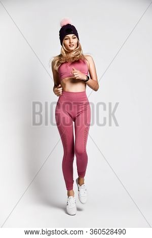 Beautiful Sexy Blonde Woman With Perfect Athletic Slim Figure By Physical Education Or Fitness, Lead