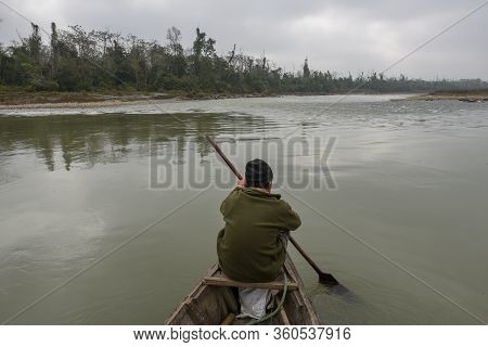 Tourists On A Canoe Safari At Chitwan National Park On Nepal