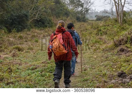 Tourists On A Safari Walk At Chitwan National Park On Nepal