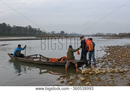 Tourists On A Canoe Safari At Chitwan National Park On Nepal