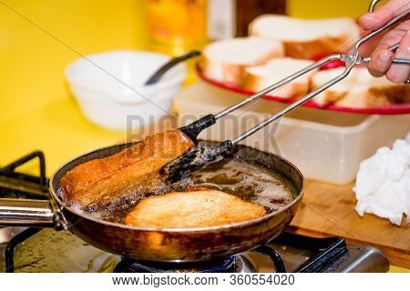 Frying Bread To Make A Typical Spanish Food, Torrijas.