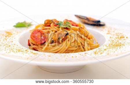 Spaghetti With Mussels Bottarga Fish And Cherry Tomatoes