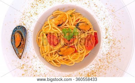 Spaghetti With Mussels Bottarga Fish And Cherry Tomatoes