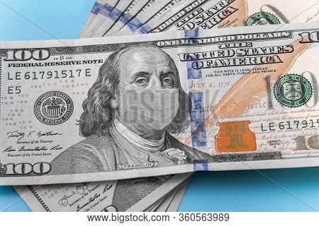 Photo Illustration Of Ben Franklin In A Mask On A Dollar 100 Bill. Displays Problems In The World An