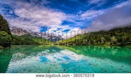 Lago Di Barcis In The Italien Alps At A Warm But Cloudy Day.