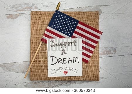 Support A Dream Shop Small Sign One American Flag Flat Lay Background